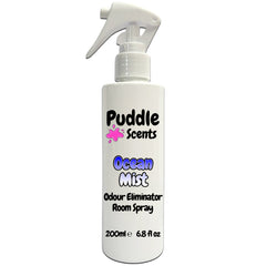 White spray bottle labeled 'Puddle Scents Ocean Mist Odour Eliminator Room Spray' on a white background