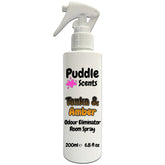 Odour eliminator room spray bottle labeled 'Puddle Scents Tonka & Amber' on a white background