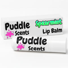 Puddle Scents lip balm with packaging on a white background